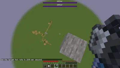 Gracz w Minecraft trzyma mace, patrząc na dwie paski życia Witherów nad zniszczoną wioską.